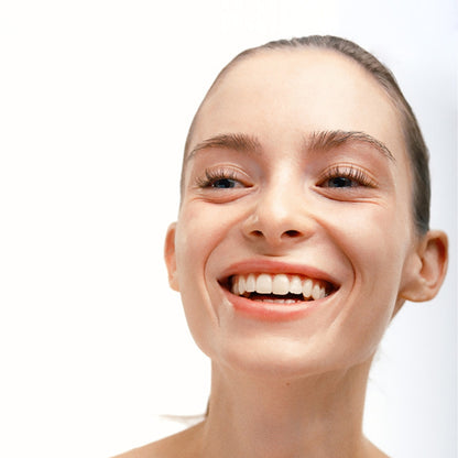 Close up of model with radiant, glowing skin